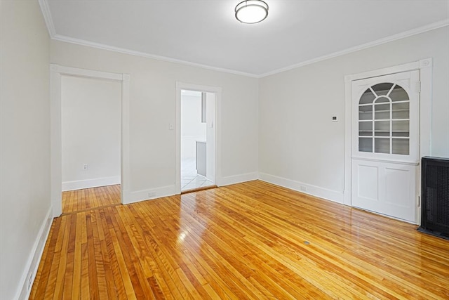 1 Melville St, Worcester, MA 01605 - spare room featuring ornamental molding, light wood-style flooring, and baseboards