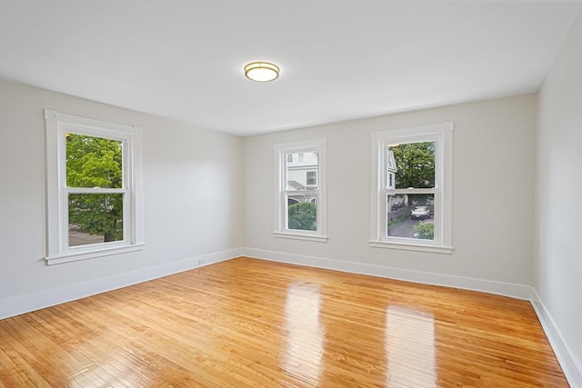 1 Melville St, Worcester, MA 01605 - spare room featuring healthy amount of natural light, light wood finished floors, and baseboards