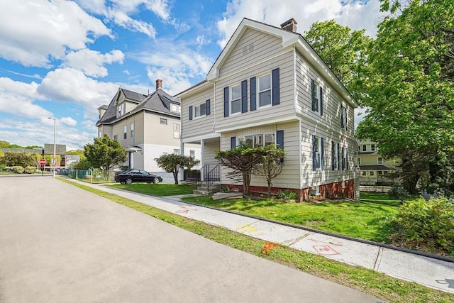 1 Melville St, Worcester, MA 01605 - view of front of house featuring a front yard and a chimney
