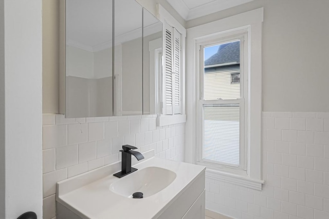 1 Melville St, Worcester, MA 01605 - bathroom featuring tile walls, vanity, ornamental molding, and wainscoting