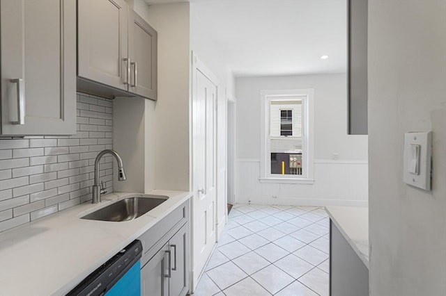 1 Melville St, Worcester, MA 01605 - kitchen featuring a sink, light countertops, gray cabinetry, backsplash, and a wainscoted wall