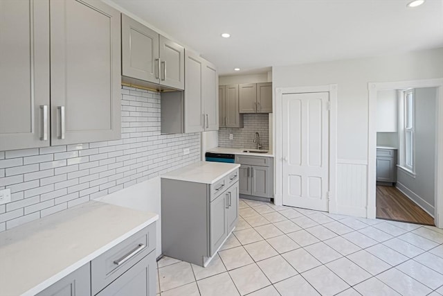 1 Melville St, Worcester, MA 01605 - kitchen featuring gray cabinetry, a sink, light tile patterned floors, recessed lighting, and decorative backsplash