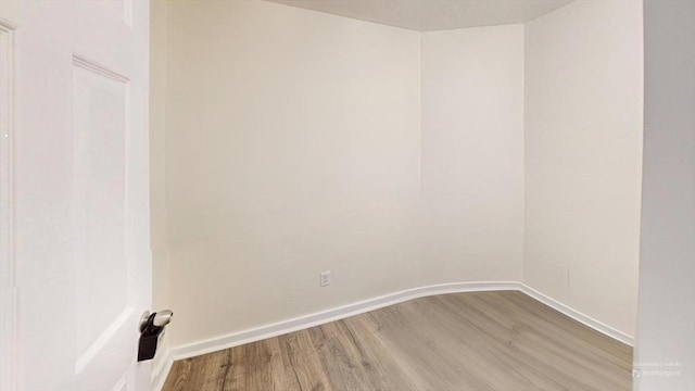 unfurnished room featuring light wood-type flooring