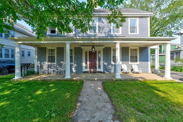 249 E Squantum St Unit 2, Quincy, MA 02171 - view of front facade with a porch and a front yard