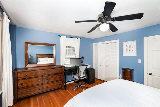 249 E Squantum St Unit 2, Quincy, MA 02171 - bedroom with dark wood-style flooring, an office area, a closet, and a ceiling fan
