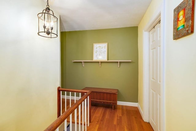 249 E Squantum St Unit 2, Quincy, MA 02171 - hall featuring a chandelier and wood finished floors