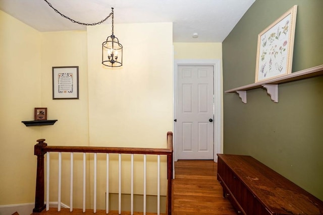 249 E Squantum St Unit 2, Quincy, MA 02171 - hall featuring wood finished floors and a chandelier