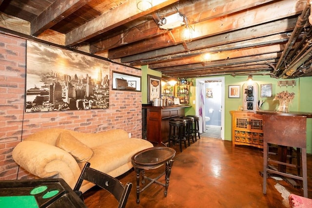 249 E Squantum St Unit 2, Quincy, MA 02171 - living room with a bar, concrete floors, and brick wall