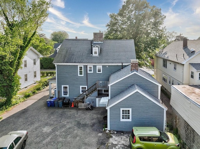 249 E Squantum St Unit 2, Quincy, MA 02171 - back of property with a chimney and stairway