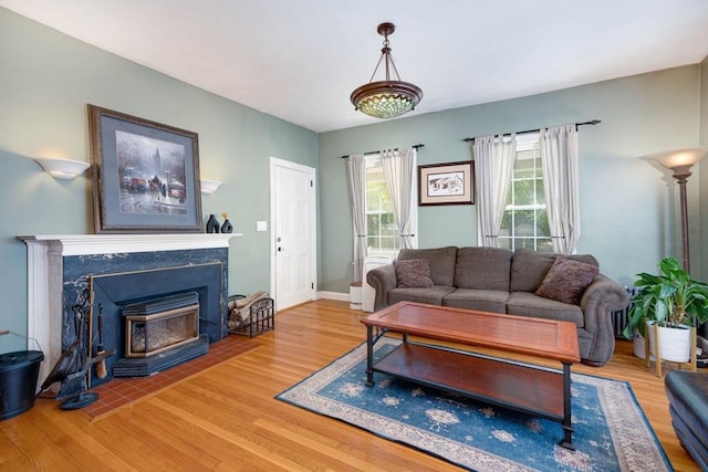 249 E Squantum St Unit 2, Quincy, MA 02171 - living room with wood finished floors and a high end fireplace
