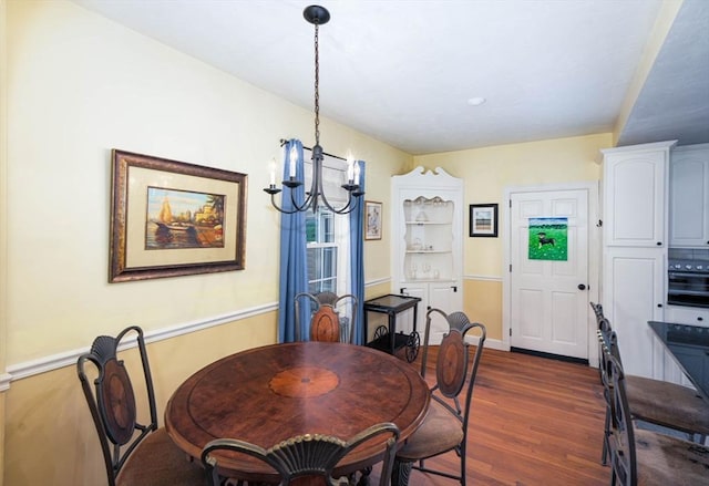 249 E Squantum St Unit 2, Quincy, MA 02171 - dining area featuring a chandelier and dark wood-style flooring