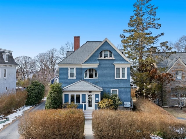 shingle-style home with a chimney