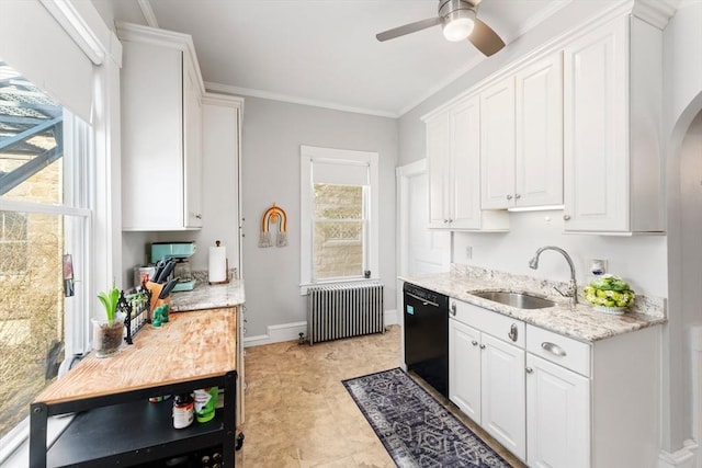 kitchen featuring light stone counters, black dishwasher, radiator heating unit, white cabinets, and a sink