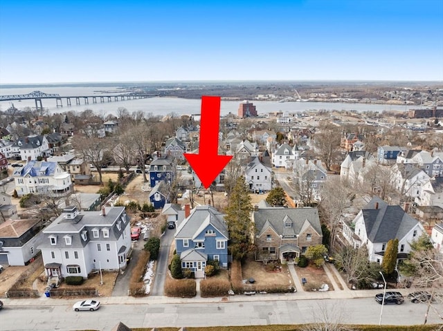 bird's eye view with a water view and a residential view