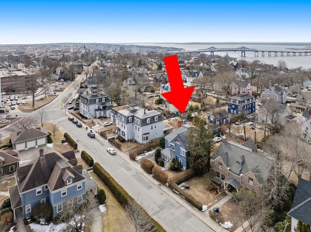 aerial view with a water view and a residential view