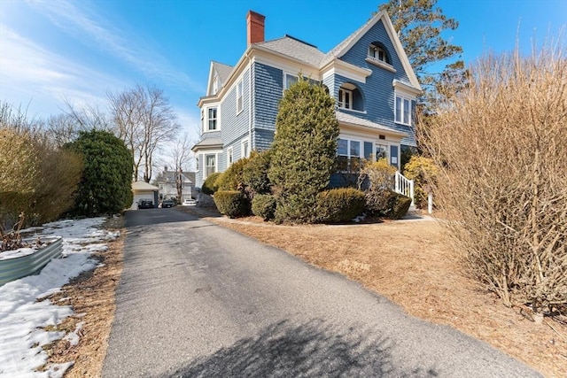 view of side of property featuring a chimney