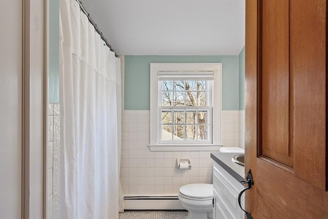 bathroom featuring vanity, a shower with curtain, a baseboard radiator, tile walls, and toilet