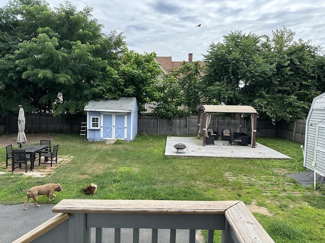 view of yard with outdoor lounge area and a shed