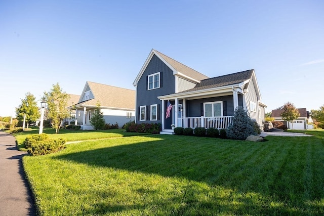 view of front of property with a front lawn and a garage