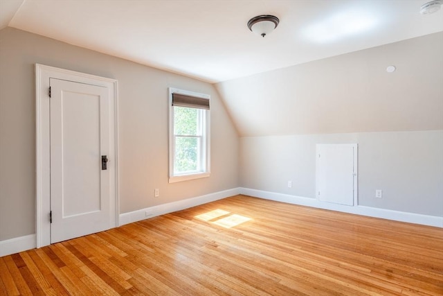 243 Bridge St, Northampton, MA 01060 - additional living space featuring vaulted ceiling, baseboards, and light wood-style floors