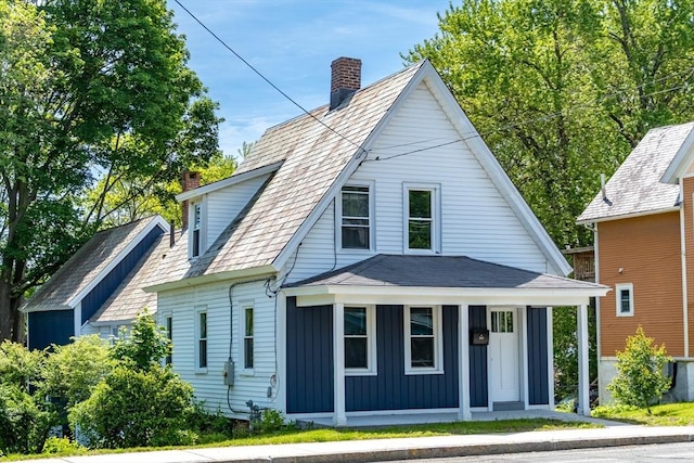 243 Bridge St, Northampton, MA 01060 - view of front of home featuring a chimney, board and batten siding, and a porch