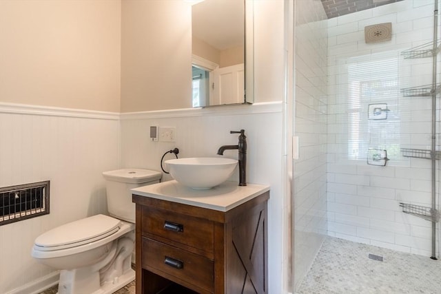 243 Bridge St, Northampton, MA 01060 - bathroom featuring wainscoting, vanity, a shower stall, and toilet