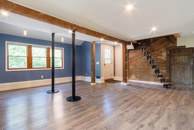 243 Bridge St, Northampton, MA 01060 - basement with healthy amount of natural light, stairs, wood finished floors, baseboards, and wooden walls