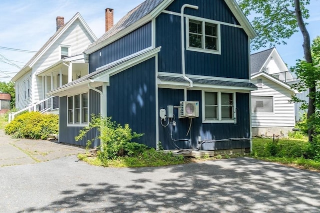 243 Bridge St, Northampton, MA 01060 - view of front of property with a cooling unit and a shingled roof