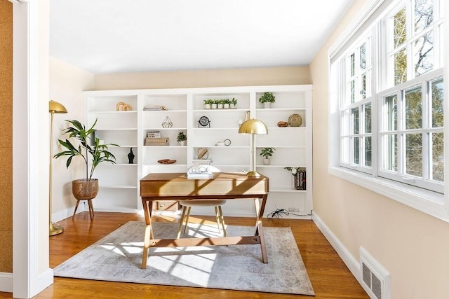 office area with hardwood / wood-style floors