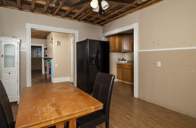 dining room featuring ceiling fan and dark hardwood / wood-style flooring