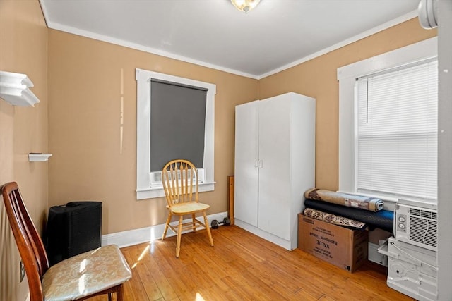 office featuring light wood-style floors, ornamental molding, and baseboards