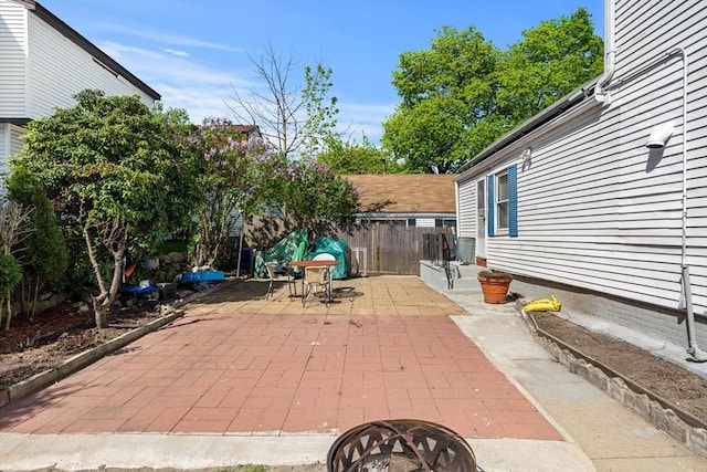 view of patio / terrace featuring fence