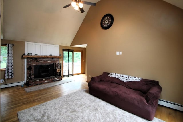 31 Trudeau Ln, East Bridgewater, MA 02333 - living room with a baseboard heating unit, baseboard heating, a ceiling fan, wood finished floors, and high vaulted ceiling