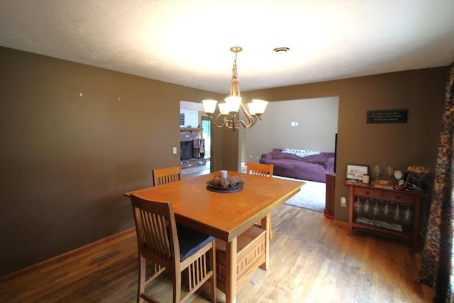31 Trudeau Ln, East Bridgewater, MA 02333 - dining area featuring wood finished floors and a chandelier