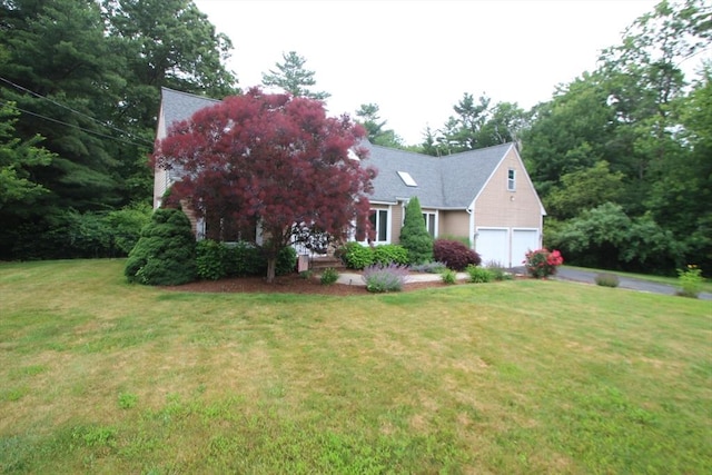 31 Trudeau Ln, East Bridgewater, MA 02333 - view of front of property featuring a garage, driveway, and a front lawn