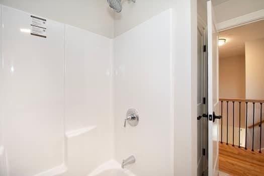 bathroom with shower / bathing tub combination