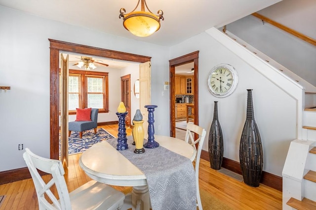 204 Massasoit Rd, Worcester, MA 01604 - dining area with light wood-style flooring, stairway, and baseboards