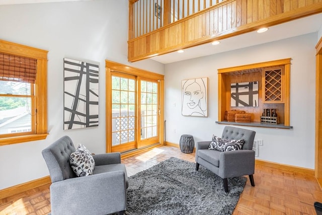 204 Massasoit Rd, Worcester, MA 01604 - living area featuring a towering ceiling, baseboards, recessed lighting, and a dry bar