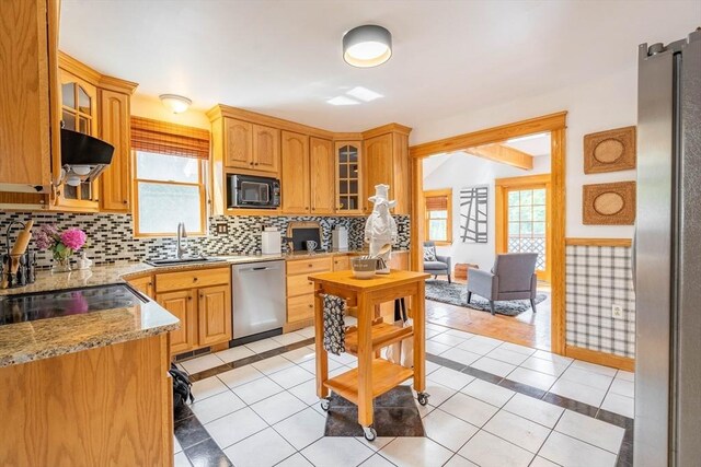 204 Massasoit Rd, Worcester, MA 01604 - kitchen with stainless steel appliances, a sink, tasteful backsplash, light stone counters, and glass insert cabinets