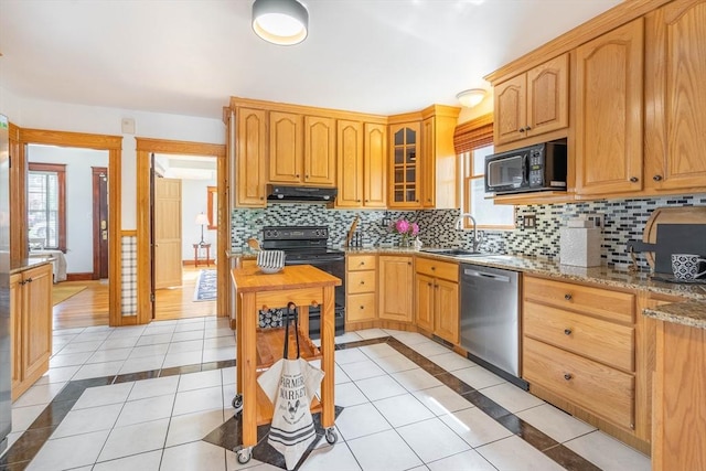 204 Massasoit Rd, Worcester, MA 01604 - kitchen featuring black appliances, under cabinet range hood, a sink, inlaid floor details, and tasteful backsplash