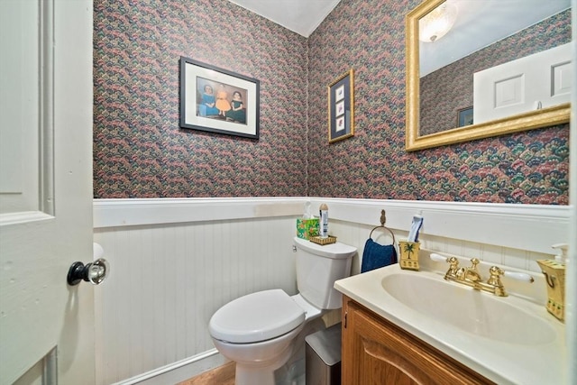 205 River St, Braintree, MA 02184 - bathroom with wainscoting, wallpapered walls, vanity, and toilet
