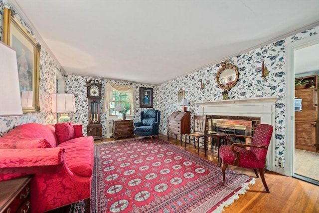 205 River St, Braintree, MA 02184 - living room with wallpapered walls, wood finished floors, a glass covered fireplace, and ornamental molding