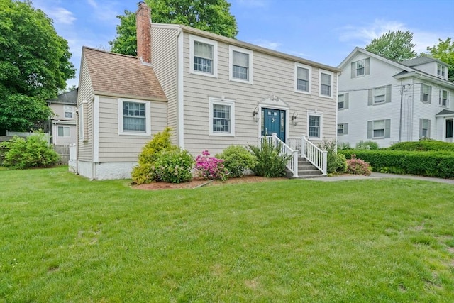 205 River St, Braintree, MA 02184 - view of front of property with a chimney and a front lawn