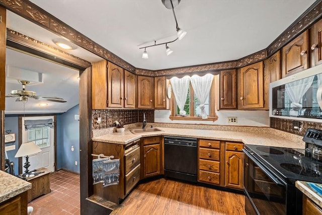 205 River St, Braintree, MA 02184 - kitchen with black appliances, a sink, ceiling fan, and healthy amount of natural light