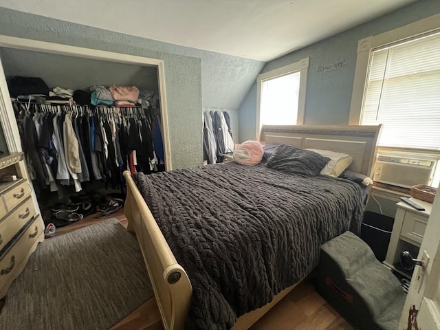 104 Temple St, Gardner, MA 01440 - bedroom with lofted ceiling, a closet, wood finished floors, and a textured wall