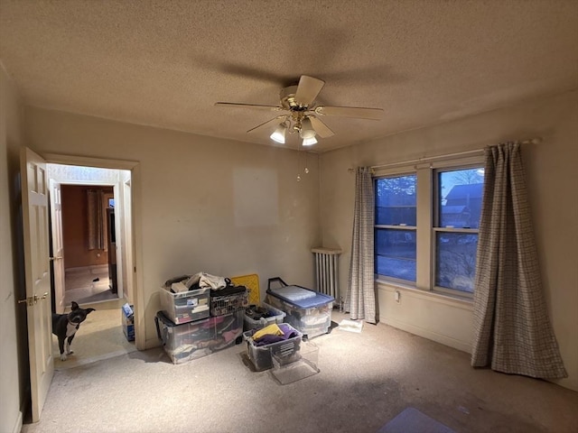 unfurnished bedroom featuring a textured ceiling and ceiling fan