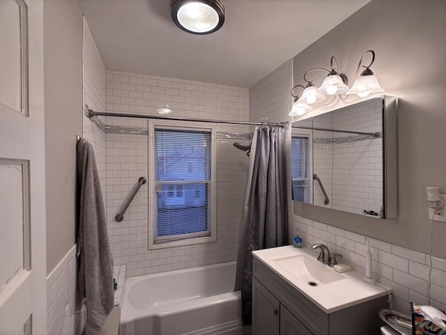 full bathroom with shower / tub combo with curtain, tile walls, toilet, decorative backsplash, and vanity