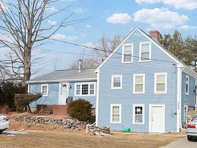 view of front of property featuring a chimney