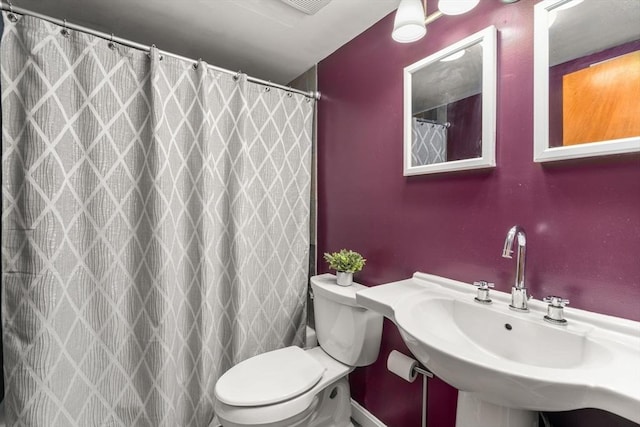 10 Williams St Unit 45, Watertown, MA 02472 - bathroom with a shower with curtain, a sink, and toilet