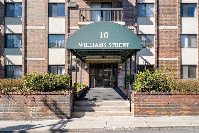 10 Williams St Unit 45, Watertown, MA 02472 - view of exterior entry with brick siding